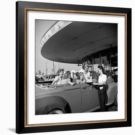 Women and Girls, in Convertible at Drive In, Greet Female Car Hop, Who Just Brought Their Drinks-Nina Leen-Framed Photographic Print