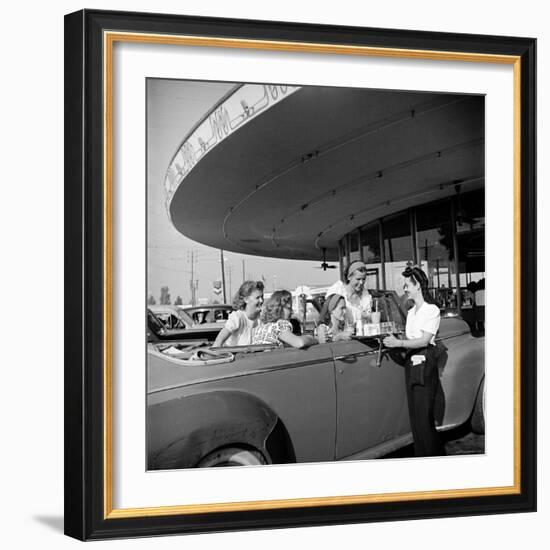 Women and Girls, in Convertible at Drive In, Greet Female Car Hop, Who Just Brought Their Drinks-Nina Leen-Framed Photographic Print