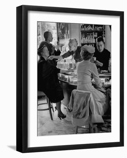 Women at a Powder Bar in Department Store Being Advised on Make Up by Operators-Leonard Mccombe-Framed Photographic Print