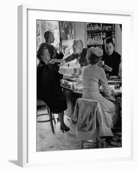 Women at a Powder Bar in Department Store Being Advised on Make Up by Operators-Leonard Mccombe-Framed Photographic Print