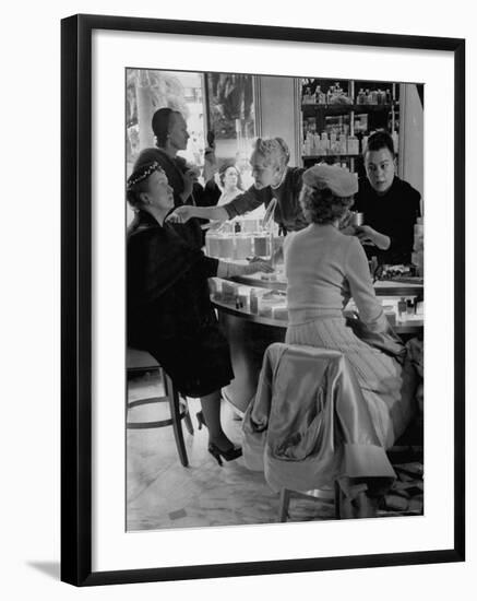 Women at a Powder Bar in Department Store Being Advised on Make Up by Operators-Leonard Mccombe-Framed Photographic Print