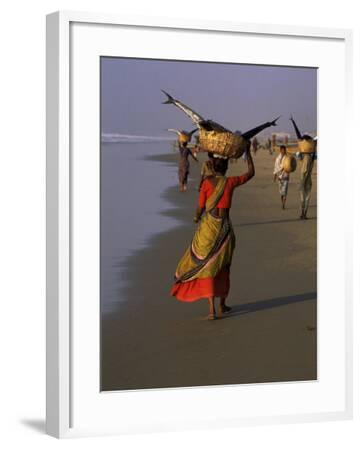 Women Carrying Fish Catch To The Market Of Fishing Village Puri