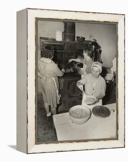 Women Cooking Spaghetti and Frying Chicken on an Old Stove for the Grape Festival-null-Framed Stretched Canvas