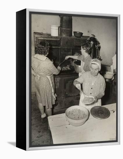 Women Cooking Spaghetti and Frying Chicken on an Old Stove for the Grape Festival-null-Framed Stretched Canvas