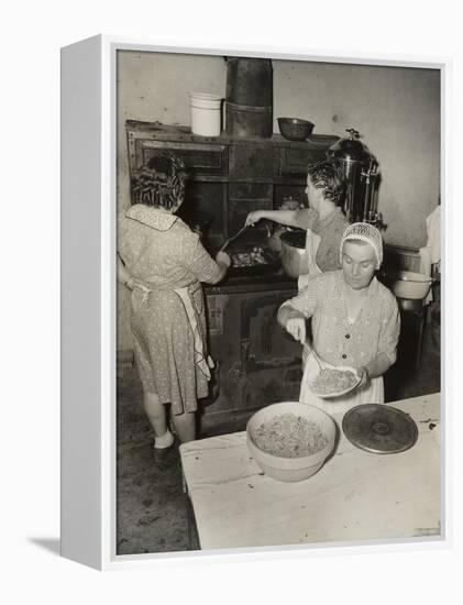 Women Cooking Spaghetti and Frying Chicken on an Old Stove for the Grape Festival-null-Framed Stretched Canvas