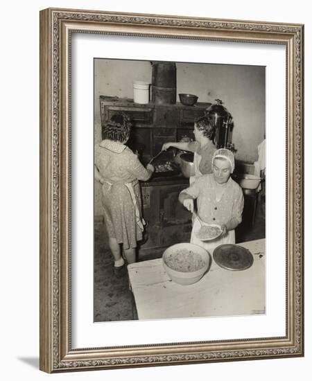 Women Cooking Spaghetti and Frying Chicken on an Old Stove for the Grape Festival-null-Framed Photo