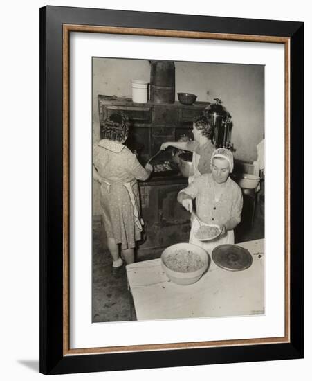 Women Cooking Spaghetti and Frying Chicken on an Old Stove for the Grape Festival-null-Framed Photo