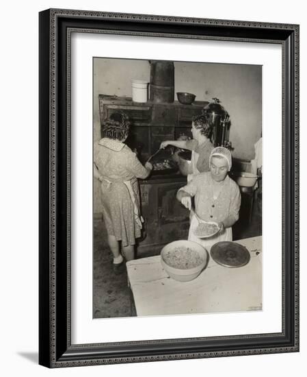 Women Cooking Spaghetti and Frying Chicken on an Old Stove for the Grape Festival-null-Framed Photo