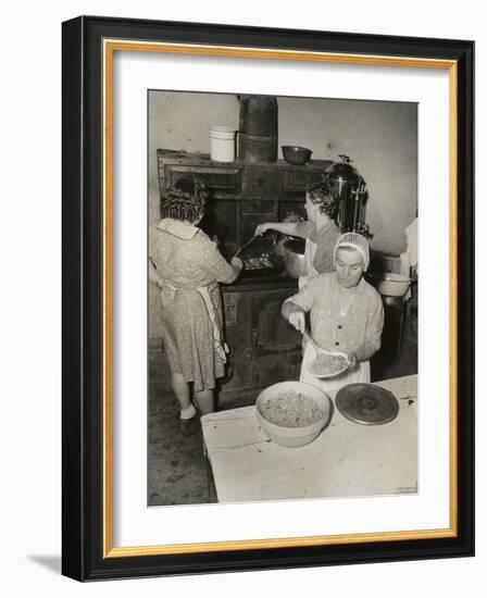 Women Cooking Spaghetti and Frying Chicken on an Old Stove for the Grape Festival-null-Framed Photo