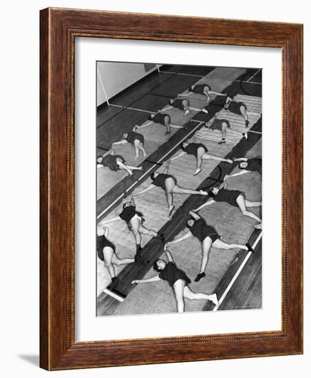 Women Doing Calisthenics to Music in Exercise Class in the Gymnasium of Riverside Church-Margaret Bourke-White-Framed Photographic Print