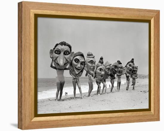 Women Holding Giant Masks-Bettmann-Framed Premier Image Canvas