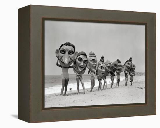 Women Holding Giant Masks-Bettmann-Framed Premier Image Canvas