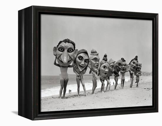 Women Holding Giant Masks-Bettmann-Framed Premier Image Canvas