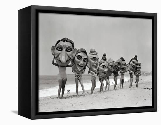 Women Holding Giant Masks-Bettmann-Framed Premier Image Canvas