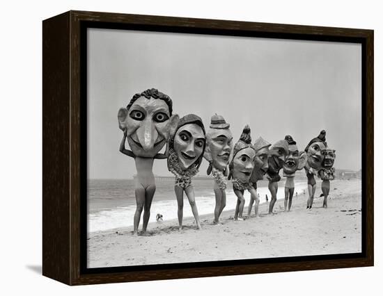 Women Holding Giant Masks-Bettmann-Framed Premier Image Canvas