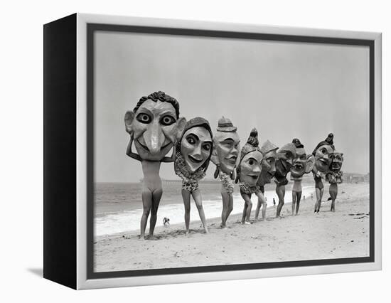 Women Holding Giant Masks-Bettmann-Framed Premier Image Canvas