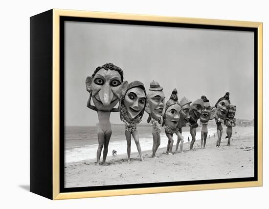 Women Holding Giant Masks-Bettmann-Framed Premier Image Canvas