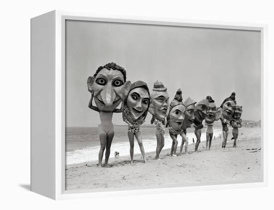 Women Holding Giant Masks-Bettmann-Framed Premier Image Canvas