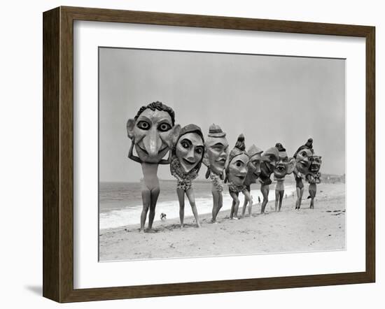 Women Holding Giant Masks-Bettmann-Framed Photographic Print