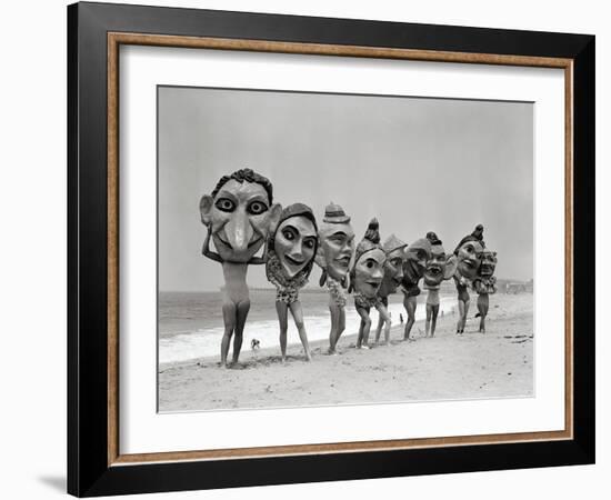 Women Holding Giant Masks-Bettmann-Framed Photographic Print