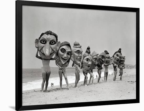 Women Holding Giant Masks-Bettmann-Framed Photographic Print