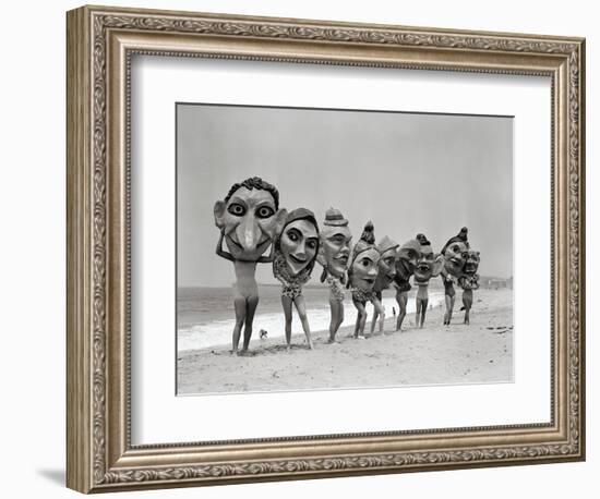 Women Holding Giant Masks-Bettmann-Framed Photographic Print