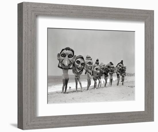 Women Holding Giant Masks-Bettmann-Framed Photographic Print