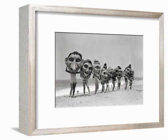 Women Holding Giant Masks-Bettmann-Framed Photographic Print