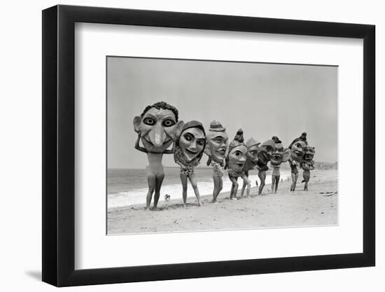 Women Holding Giant Masks-Bettmann-Framed Photographic Print