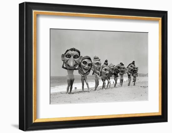 Women Holding Giant Masks-Bettmann-Framed Photographic Print