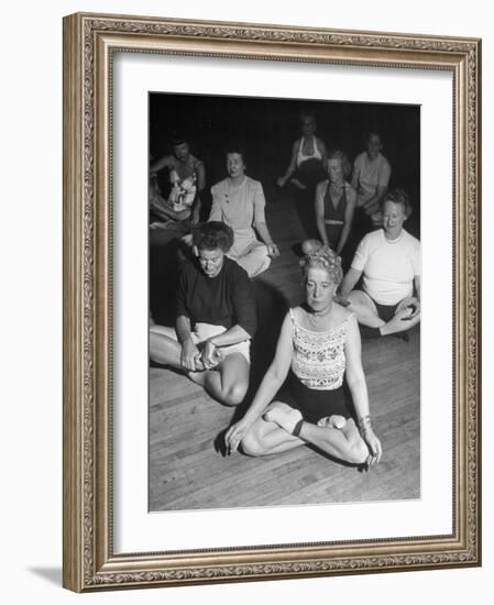 Women Meditating During their Exercises-Loomis Dean-Framed Photographic Print