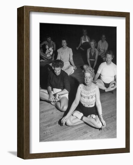 Women Meditating During their Exercises-Loomis Dean-Framed Photographic Print