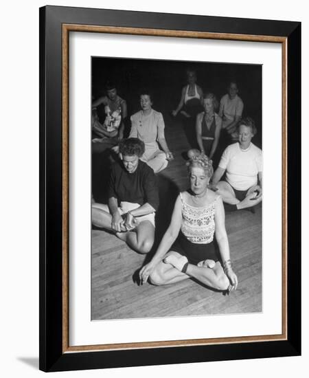 Women Meditating During their Exercises-Loomis Dean-Framed Photographic Print