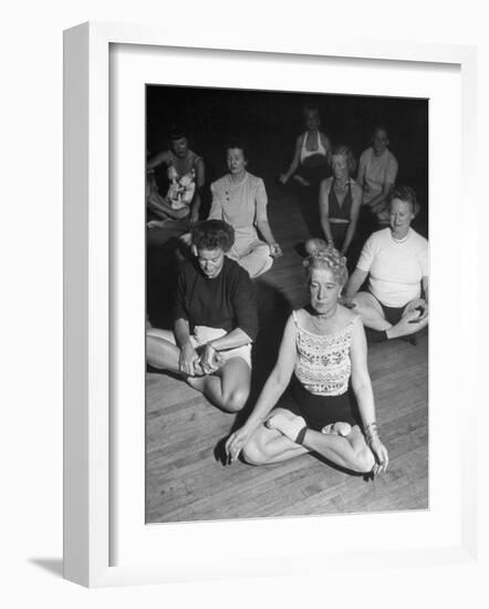 Women Meditating During their Exercises-Loomis Dean-Framed Photographic Print