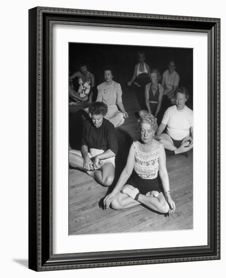 Women Meditating During their Exercises-Loomis Dean-Framed Photographic Print