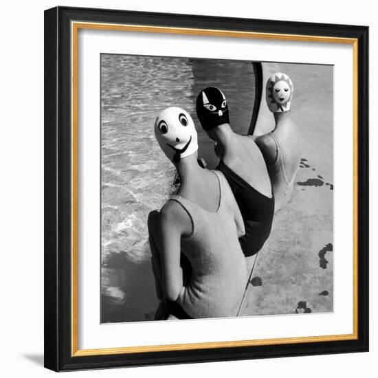 Women Modeling Bathing Caps with Faces on Them-Ralph Crane-Framed Premium Photographic Print
