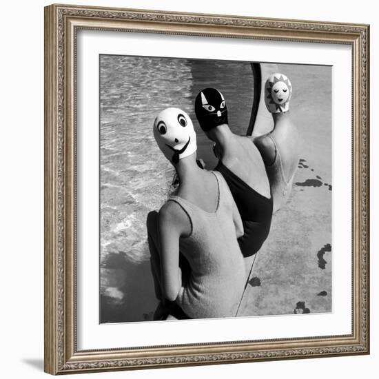 Women Modeling Bathing Caps with Faces on Them-Ralph Crane-Framed Photographic Print