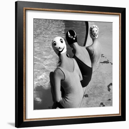 Women Modeling Bathing Caps with Faces on Them-Ralph Crane-Framed Photographic Print