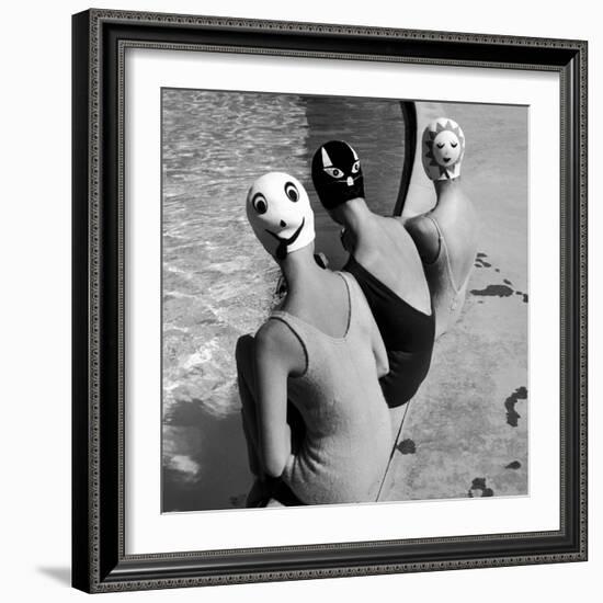 Women Modeling Bathing Caps with Faces on Them-Ralph Crane-Framed Photographic Print