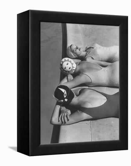 Women Modeling Bathing Caps with Faces on Them-Ralph Crane-Framed Premier Image Canvas