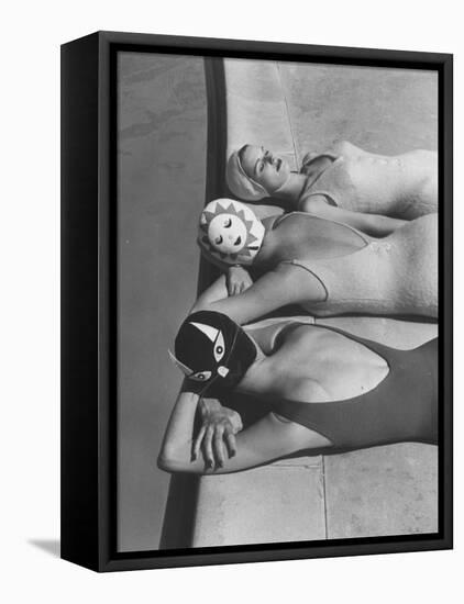 Women Modeling Bathing Caps with Faces on Them-Ralph Crane-Framed Premier Image Canvas