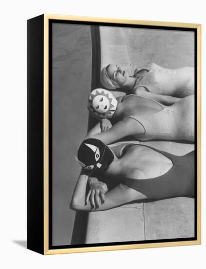 Women Modeling Bathing Caps with Faces on Them-Ralph Crane-Framed Premier Image Canvas