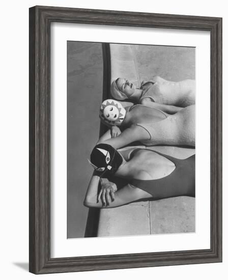 Women Modeling Bathing Caps with Faces on Them-Ralph Crane-Framed Photographic Print