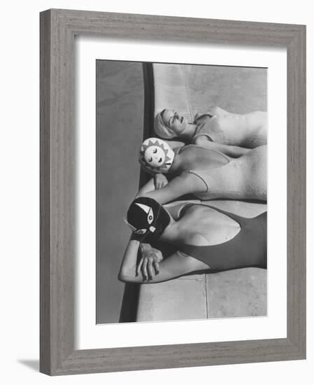 Women Modeling Bathing Caps with Faces on Them-Ralph Crane-Framed Photographic Print