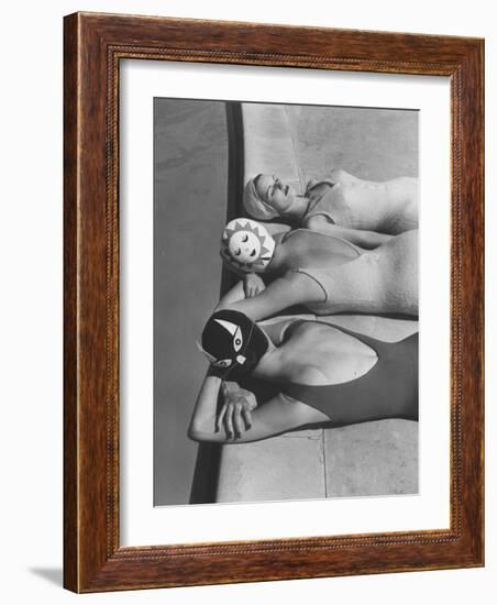 Women Modeling Bathing Caps with Faces on Them-Ralph Crane-Framed Photographic Print