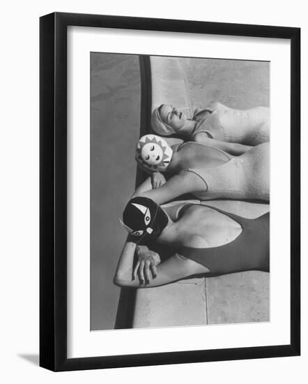 Women Modeling Bathing Caps with Faces on Them-Ralph Crane-Framed Photographic Print