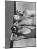 Women Modeling Bathing Caps with Faces on Them-Ralph Crane-Mounted Photographic Print