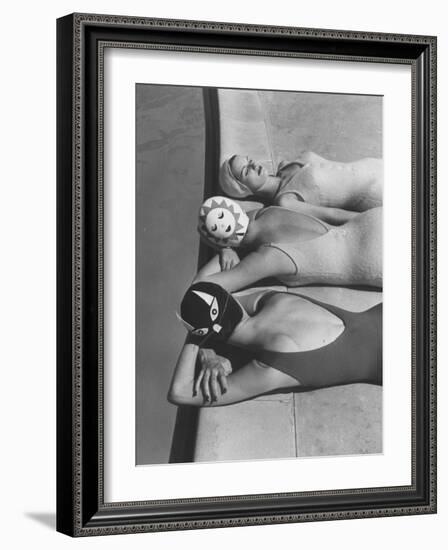 Women Modeling Bathing Caps with Faces on Them-Ralph Crane-Framed Photographic Print