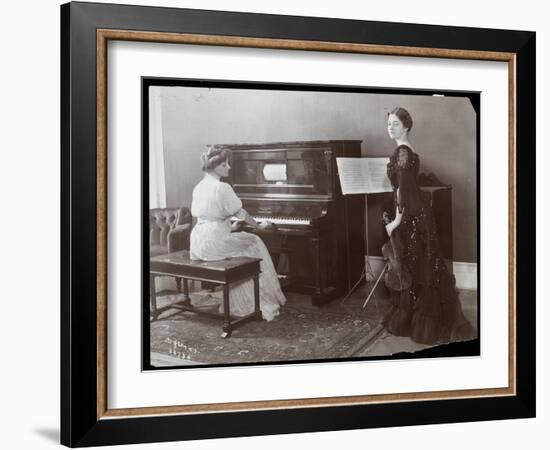Women Playing a Player Piano and a Violin, New York, 1907-Byron Company-Framed Giclee Print