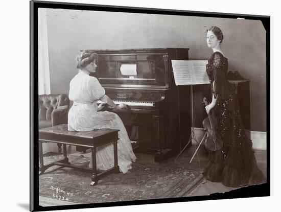 Women Playing a Player Piano and a Violin, New York, 1907-Byron Company-Mounted Giclee Print